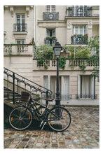 Bike on a cobblestone street in Europe poster - egoamo.co.za